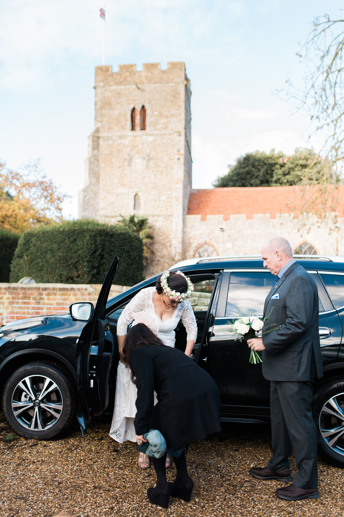Bride getting out of car